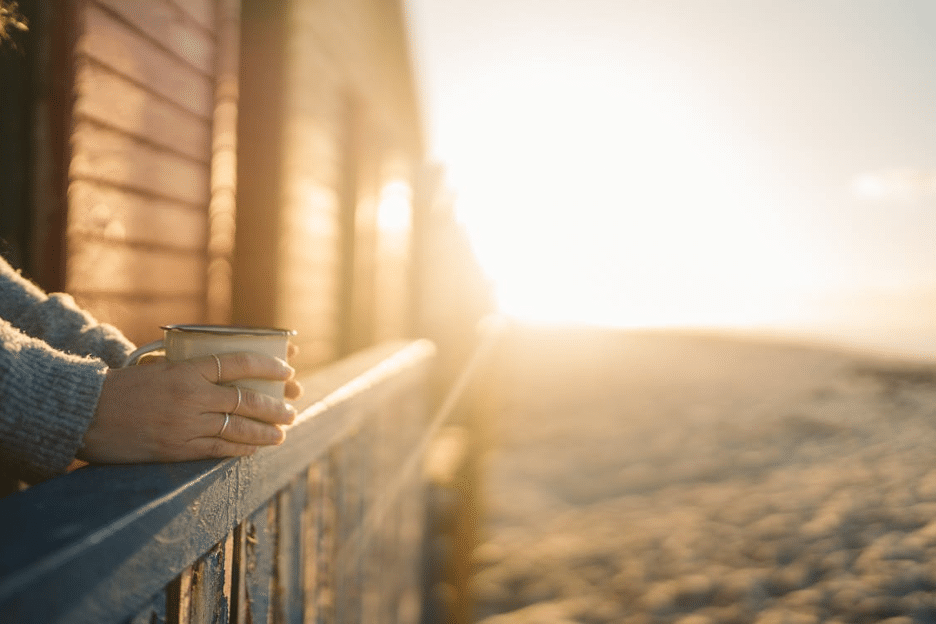 Person drinking a hot drink in a home powered by a Generac Generator.